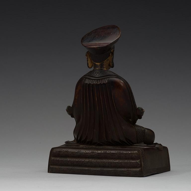 A Sino-Tibetan bronze figure of a Lama, early 20th Century.