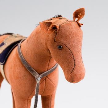 A horse on wheels probably by Steiff 1910.