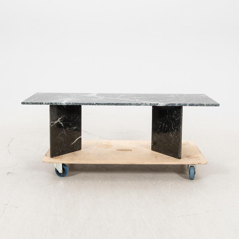 A marble coffee table alter part of the 20th century/21st century.