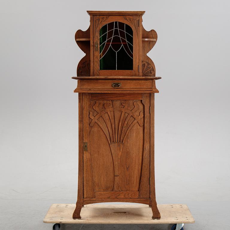 An oak art noveau cabinet, early 20th Century.