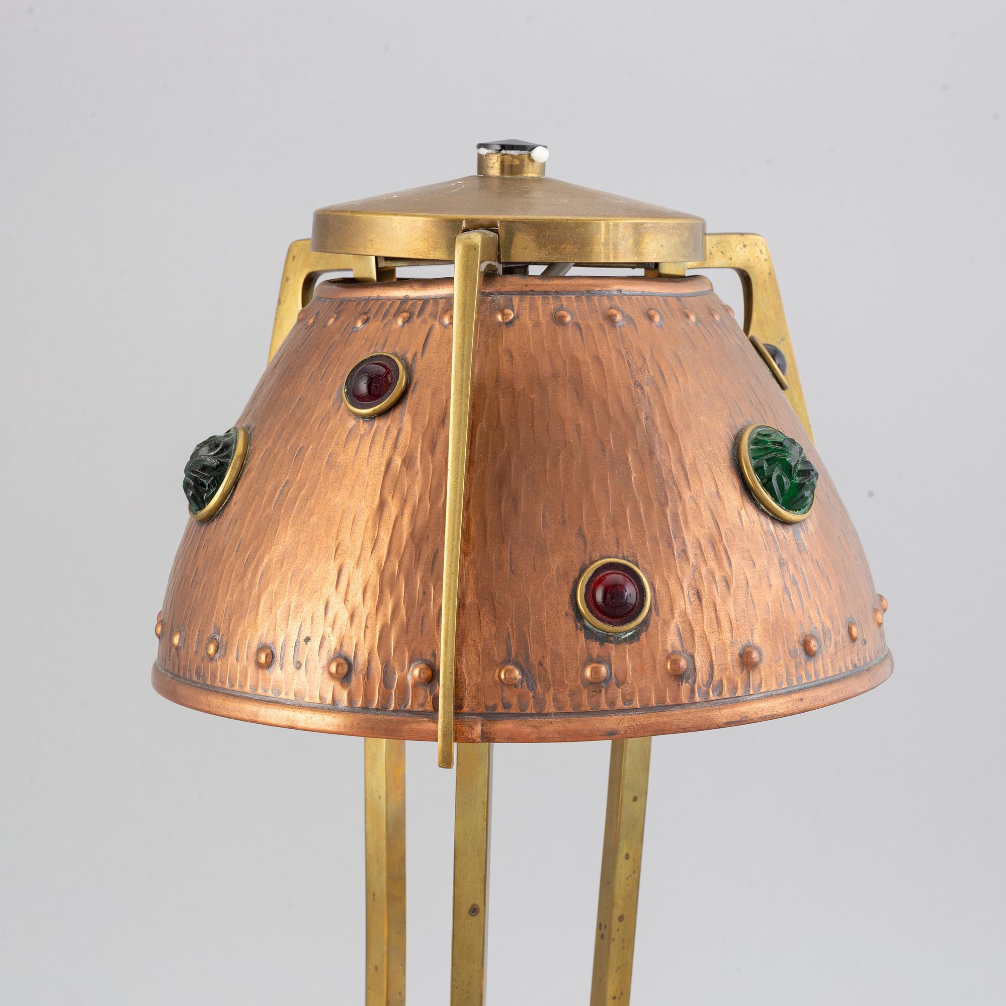 An early 20th century, brass and copper table lamp.