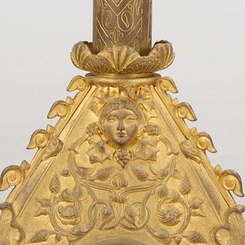 Two similar 19th century bronze candelabras.