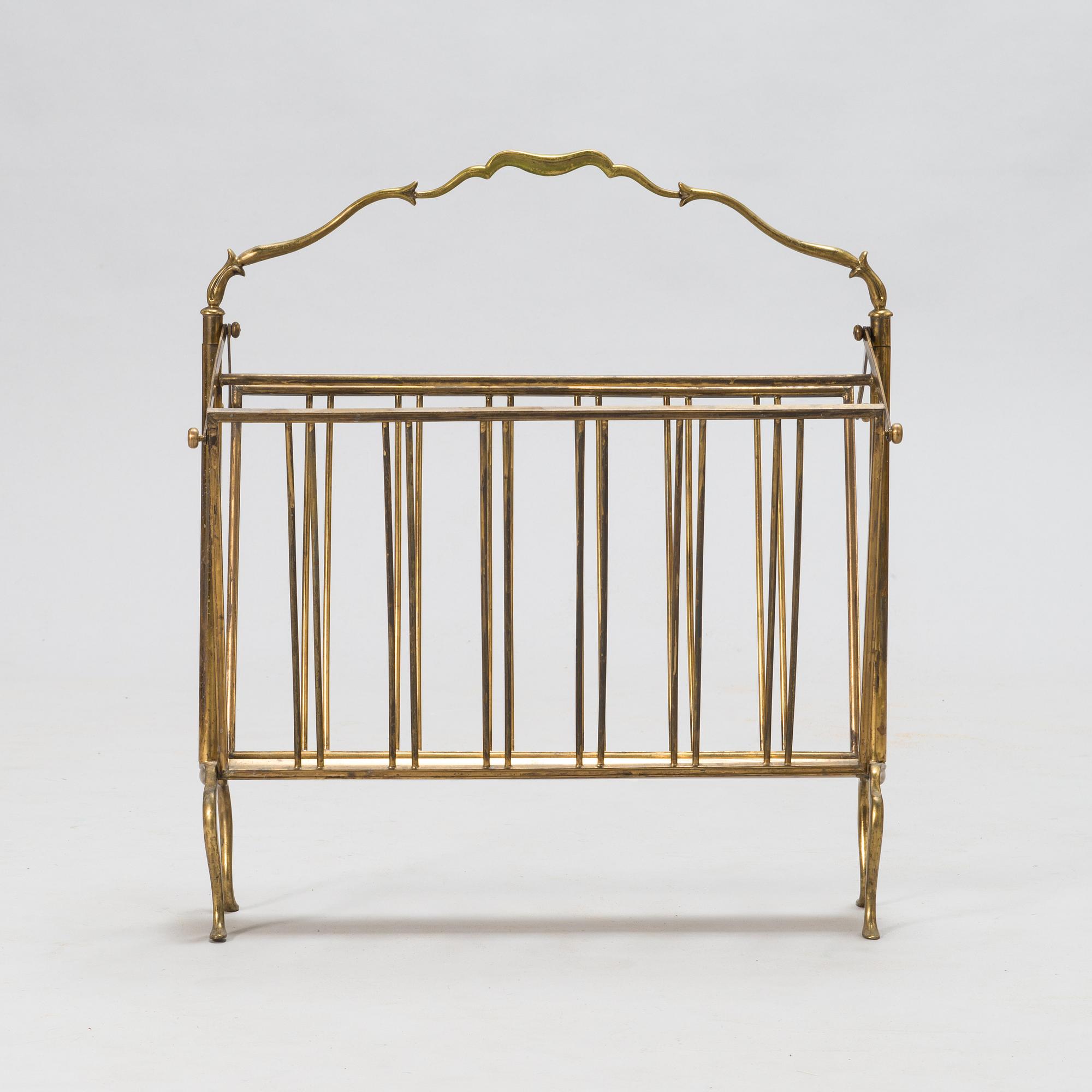 A folding brass magazine stand, first half of the 20th century.