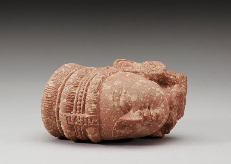 A mottled red sandstone head of Guanyin, Mathura, India, presumably 200-500 AD.