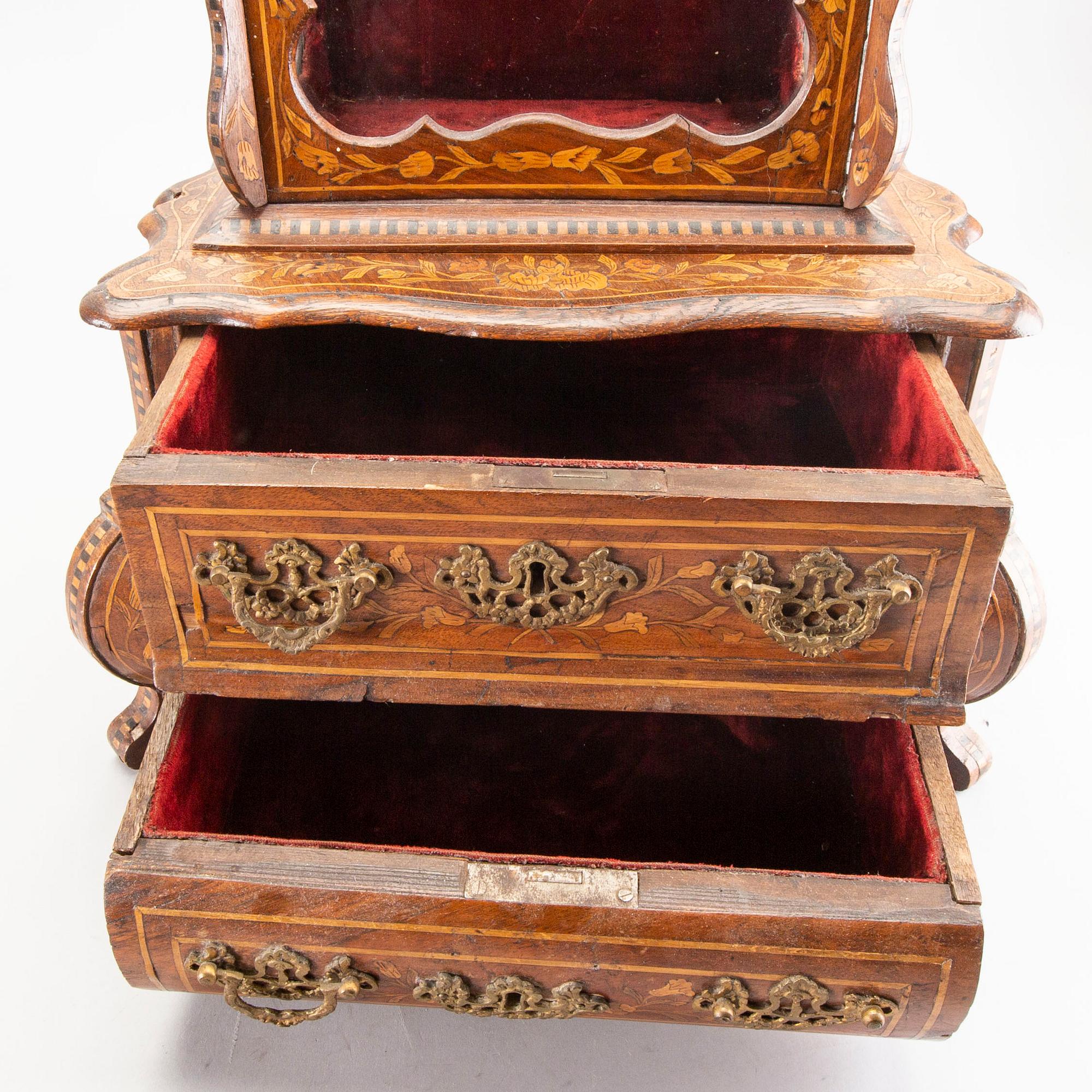 A Louis XV-style miniature cabinet around 1900.
