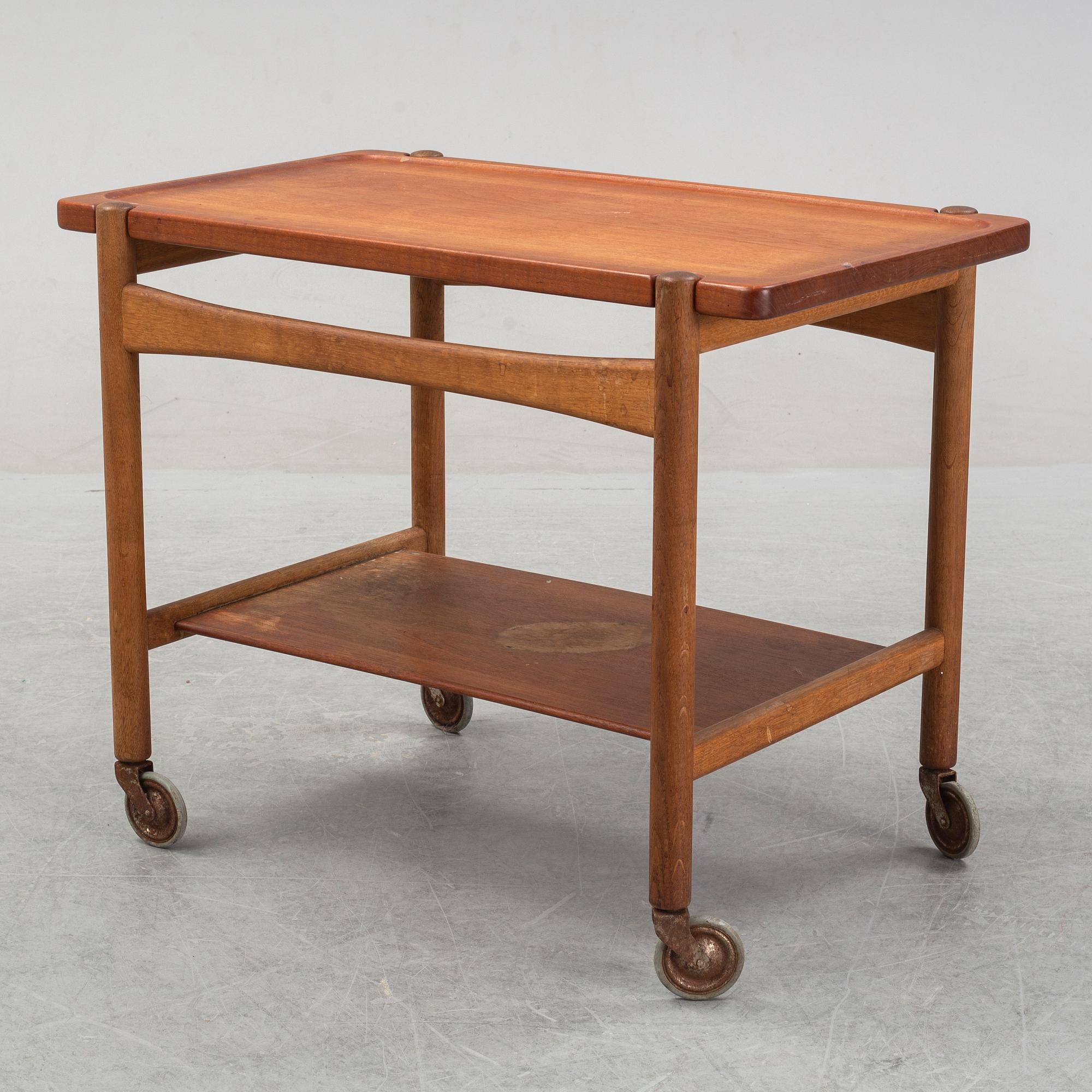 Hans J Wegner, a teak and oak serving trolley from Andreas Tuck, Denmark.