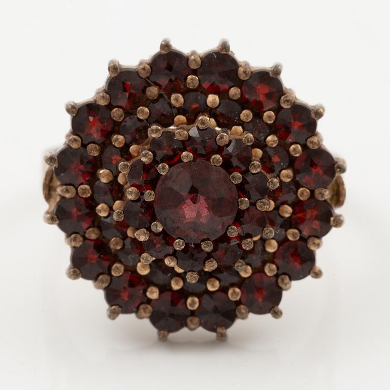 Garniture, two rings, brooch, two necklaces, and two pairs of earrings, armlet, garnets.