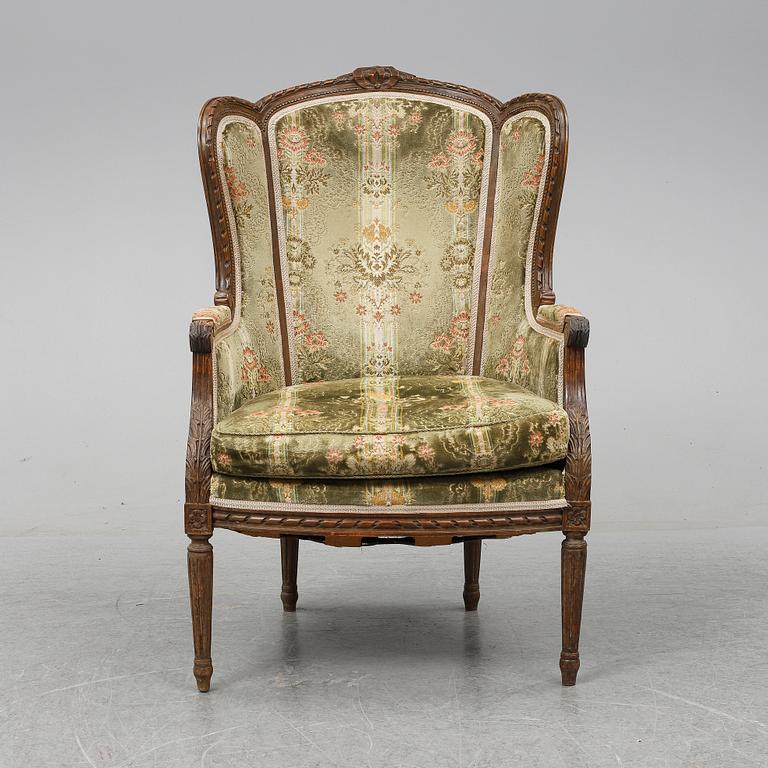 A Louis XVI style armchair from around year 1900-.