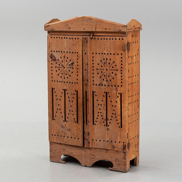 A late 19th century pine cupboard for eggs.