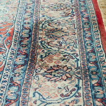 A carpet from Turkey. Circa 383x277 cm.