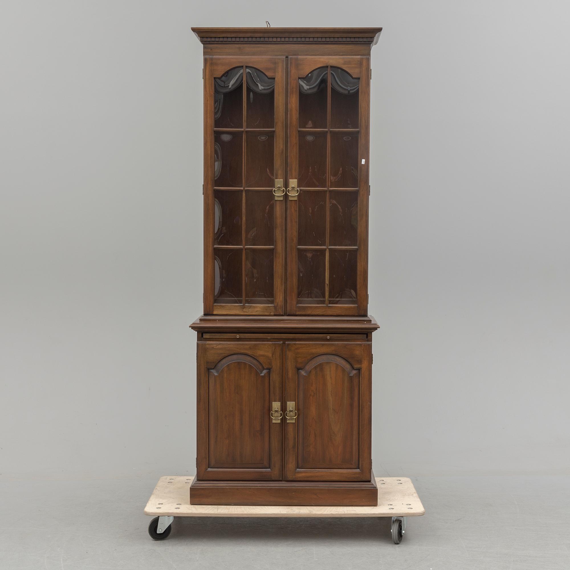 A second half of the 20th century vitrine cabinet marked "Pennsylvania House".