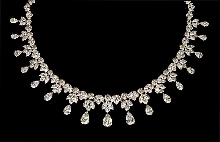 An important diamond necklace, tot. 39 cts of drop- brilliant- and navett cut diamonds.