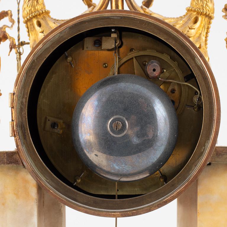 A Louis XVI marble and ormolu portico clock, the dial signed Bouchet, late 18th century.