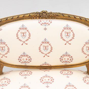 A Gustavian style sofa with two armchairs and two chairs, 20th century.
