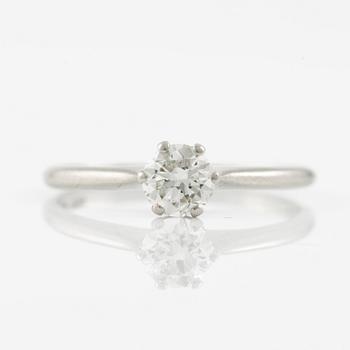 Platinum ring with brilliant-cut diamond.
