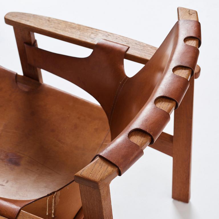 Carl-Axel Acking, a "Trienna" oak and natural leather easy chair, for Nordiska Kompaniet, Sweden 1960's.