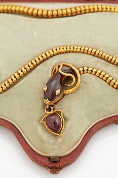 A 14K gold necklace set with garnets and rose-cut diamonds.