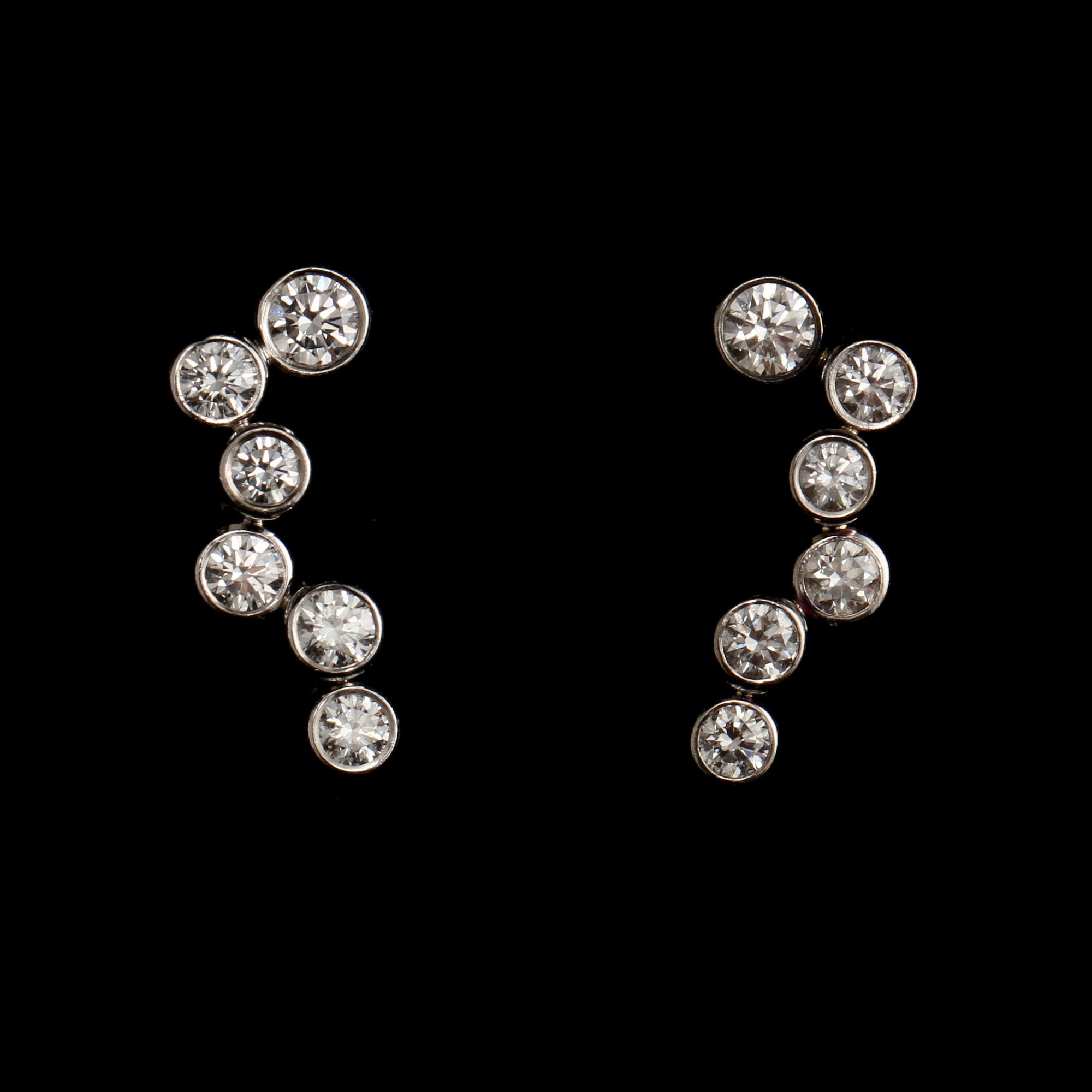 GARNITYR, 2 delar, 18k vitguld med 21 briljantslipade diamanter, Georg Jensen.  Vikt 25 g.