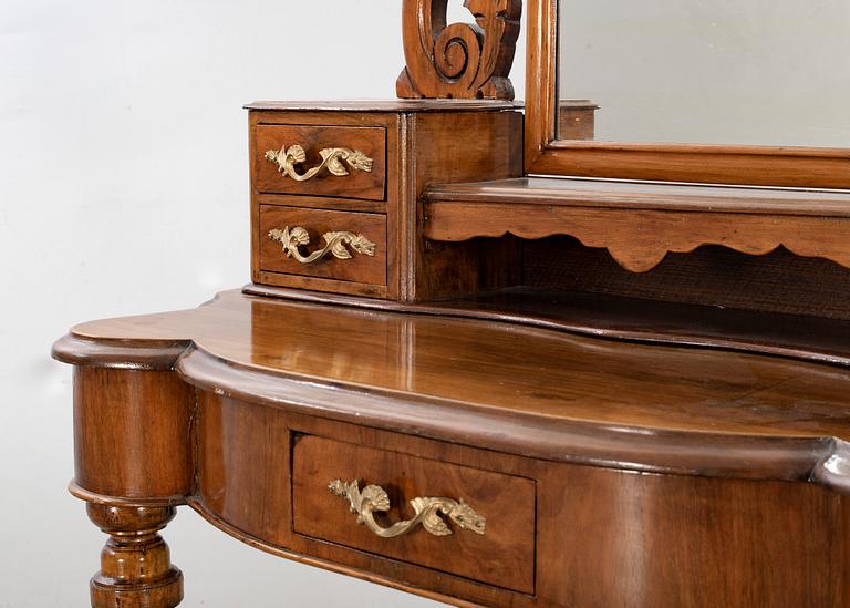 A second half of the 19th century table with mirror and a stool.