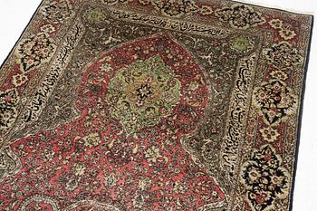 A semi-antique silk Quum, c. 216 x 141 cm.