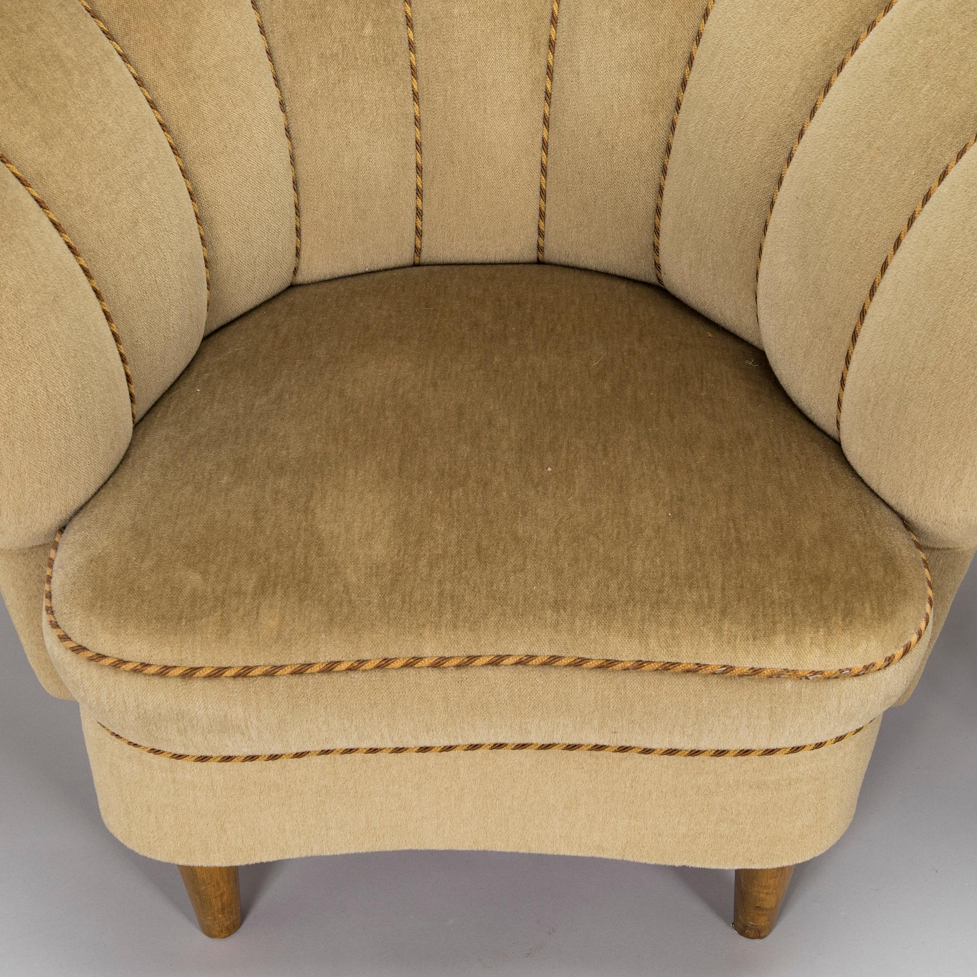 A pair of mid-20th century armchairs.
