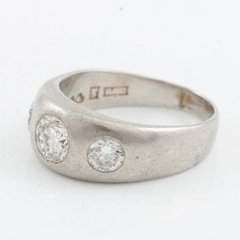 Ring, signet ring, platinum and three brilliant-cut diamonds.