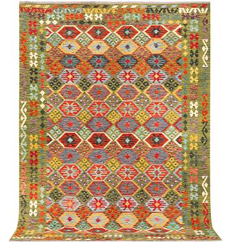 An Afghan kelim carpet, c. 302 x 215 cm.