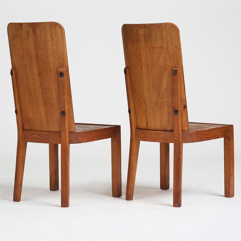 Axel Einar Hjorth, a pair of stained pine "Lovö" chairs, Nordiska Kompaniet, Sweden 1930's.