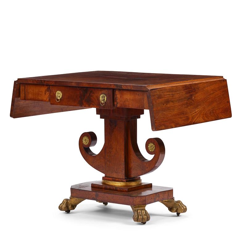 A Swedish Empire mahogany center table.