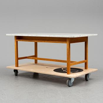 JOSEF FRANK, a model 2125 marble top coffee table from Svenskt Tenn.