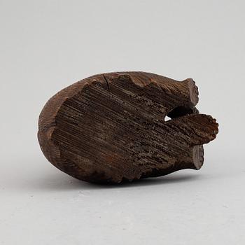 A carved wooden sculpture of a "Black forest bear" from around the year 1900.
