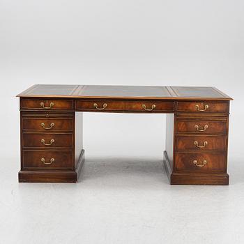 A mahogany desk, Reprodux, England, second half of the 20th Century.