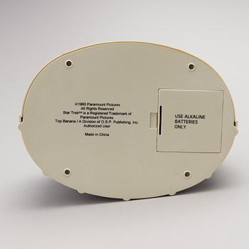 Three Vintage Toy Robots and a Table Clock.