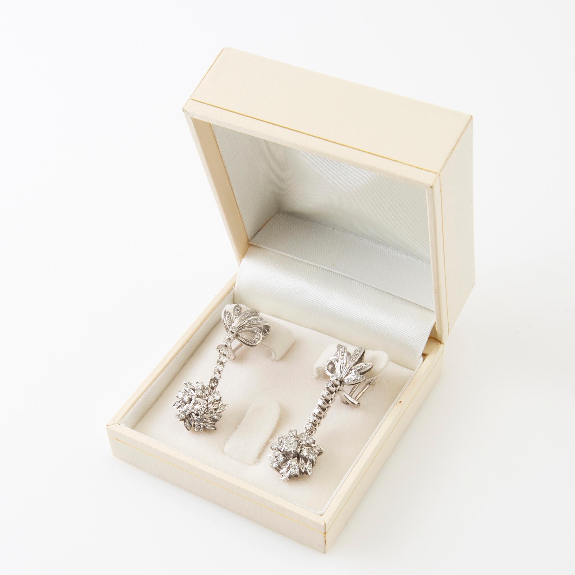 Earrings, a pair of 8K white gold with round brilliant-cut and single-cut diamonds.