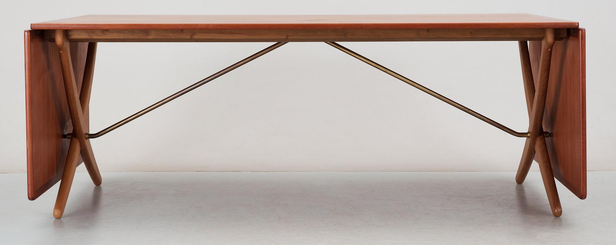 A Hans J Wegner teak and oak sabre leg dinner table by Andreas Tuck, Denmark 1950-60's.