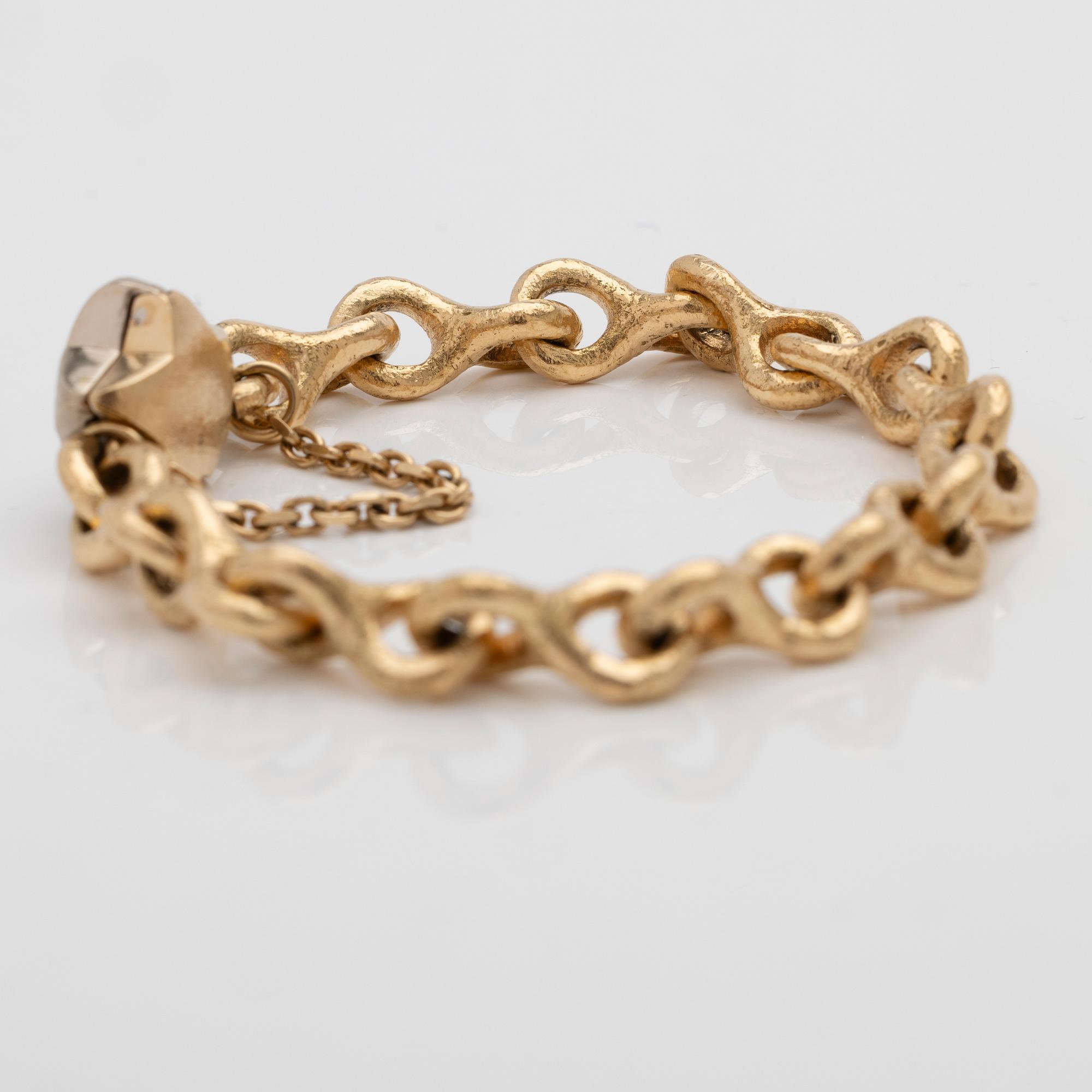 Armband 18K guld med en diamant.