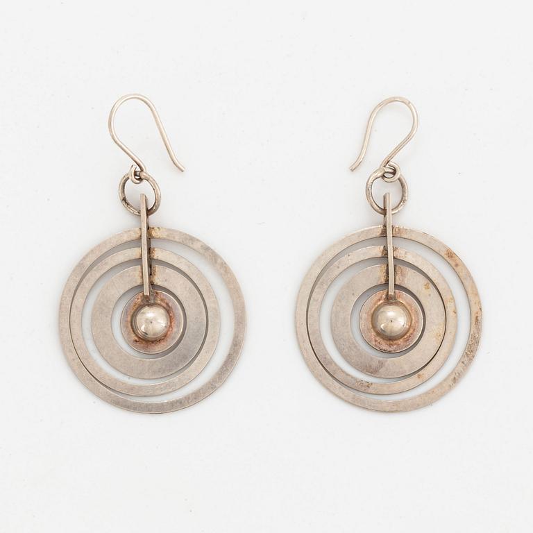 A pair of silver Tapio Wirkkala earrings.