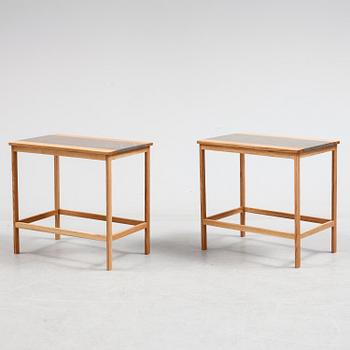 A pair of of oak and limestone tables, 21th century.