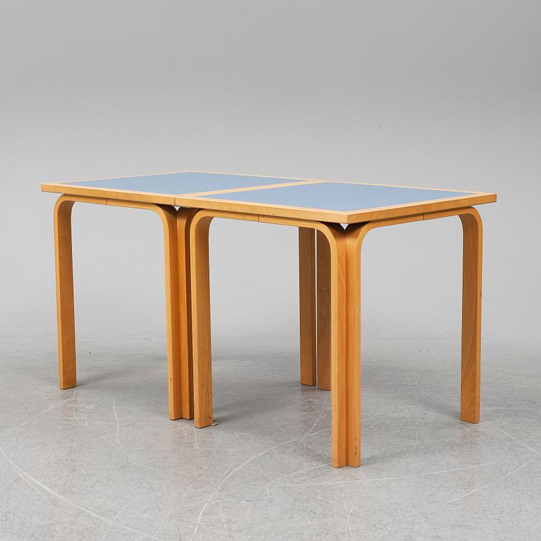 Table with four chairs, late 20th Century by Magnus Olesen.