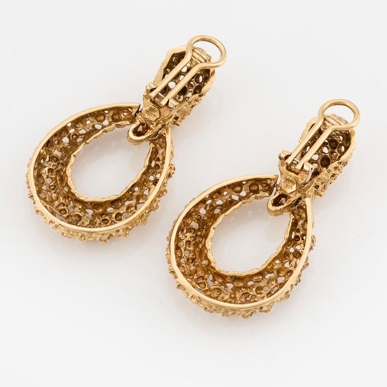 A pair of 18K gold earrings.