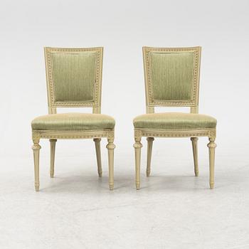 A Gustavian dining table with six chairs. Åmells dated 1974.
