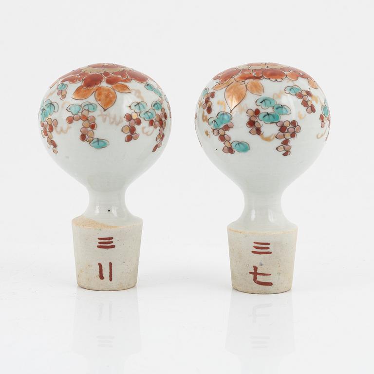 A set of Japanese porcelain bottles with stoppers, early 20th century.