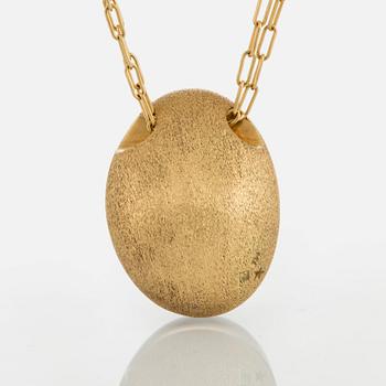 An 18K gold H Stern pendant set with a cabochon-cut rock crystal.