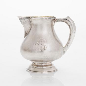 A four-piece silver coffee set, St. Petersburg 1887, original fitted box from Khlebnikov. Sugar tong, Moscow around 190.