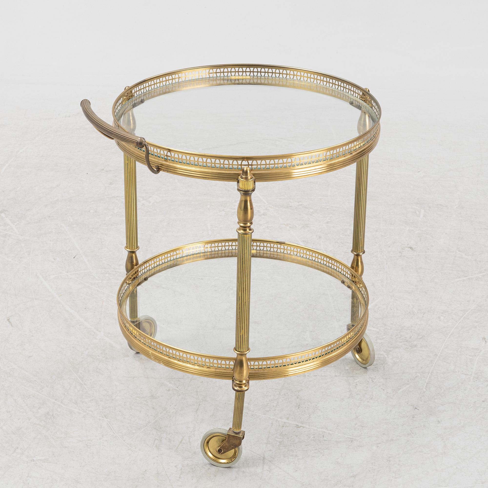 A glass and brass servin trolley, second part of the 20th Century.