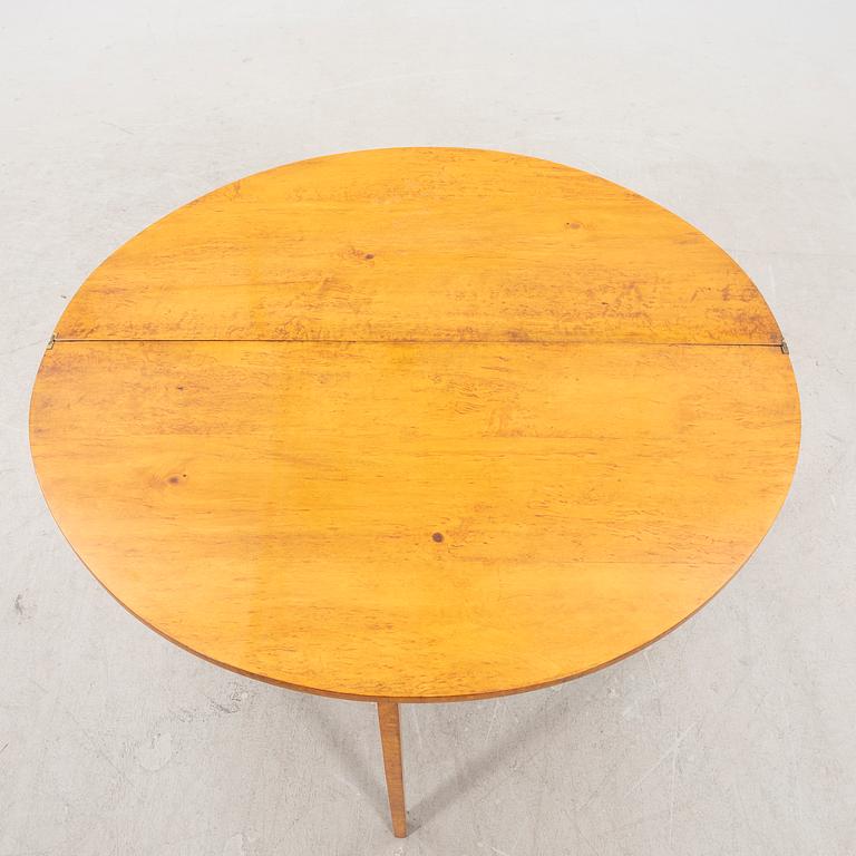 A birch folding table later part of the 19th century.