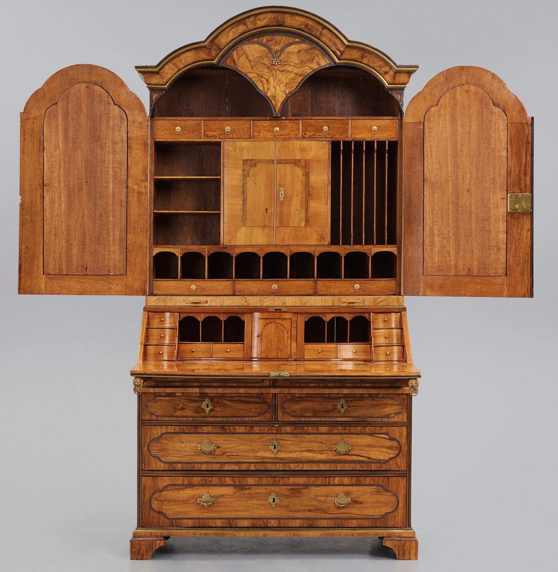 A late Baroque walnut veneer cabinet, mid 18th century.