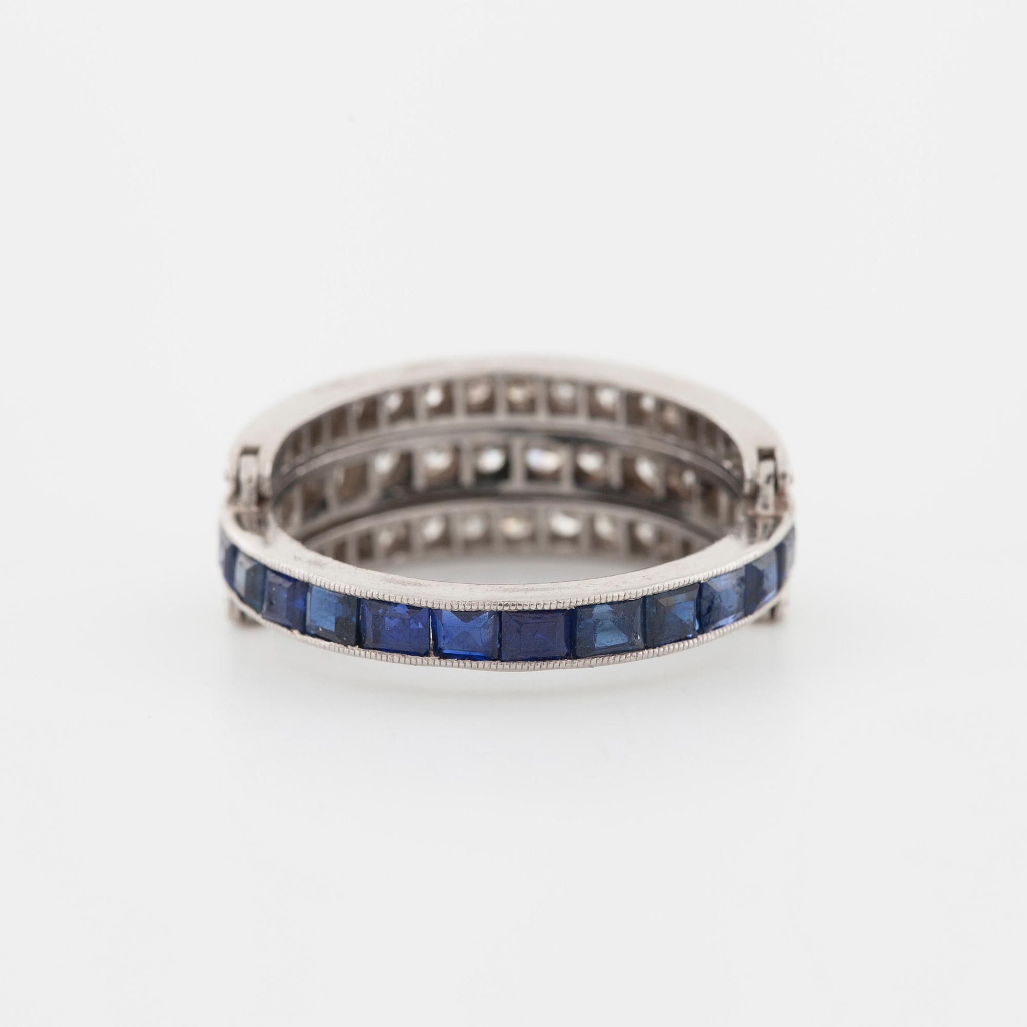 A square cut sapphire and single cut diamond ring.