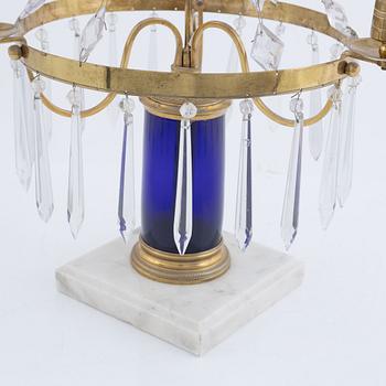 A three-light brass, marble, and glass lustre, 20th century incorporating older elements.