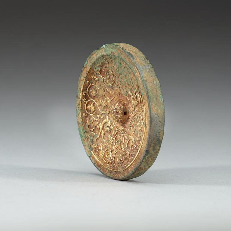 A gilt bronze mirror, Tang dynasty.